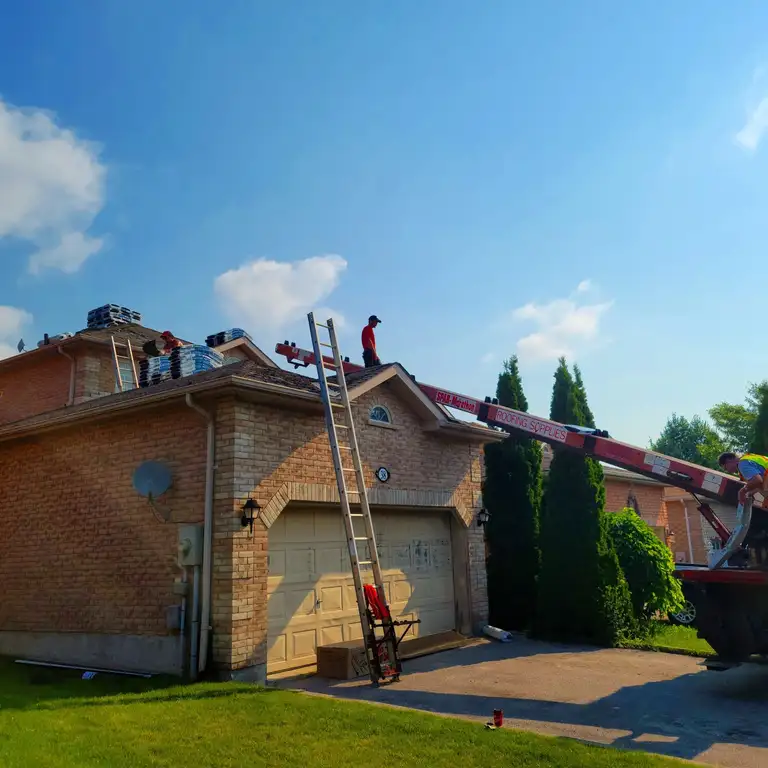 An asphalt shingle roof installed by Ready Roofing & Renovations.
