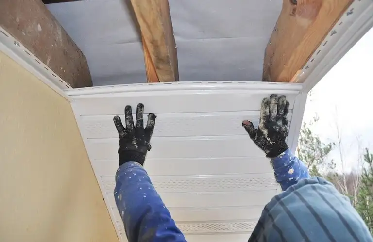 Soffit panels installed under a roof overhang.